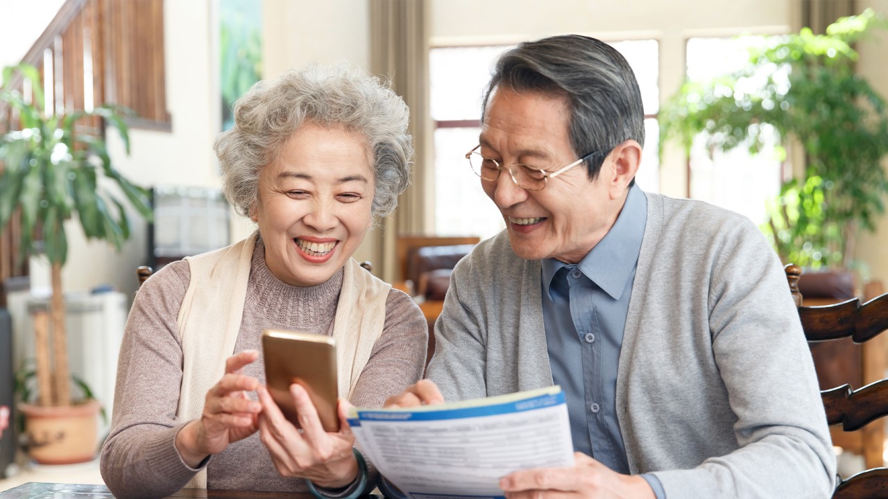 elder couple are searching information; the image used for how to achieve your legacy goals